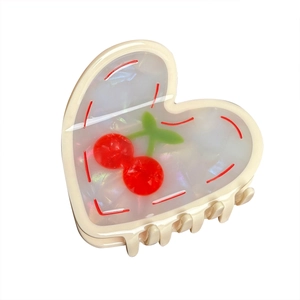Pearlescent white acetate heart claw clip with red cherry pattern and marble texture