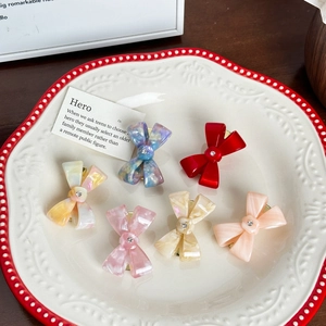 Elegant set of six acetic acid bow hair ties with central rhinestones in various colors