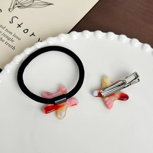 Ensemble pince à cheveux et élastique avec pendentifs étoiles en acrylique marbré