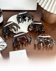 Close-up of assorted large acetate hair claws in tortoise shell and solid patterns