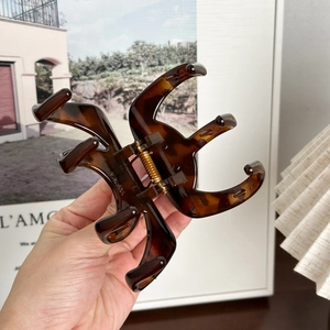 Large tortoiseshell claw clip for thick hair with strong gold spring and Paris print