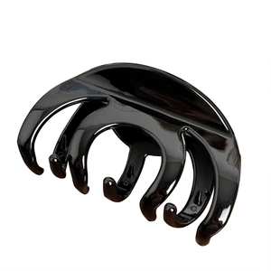 Glossy black large shark hair claw clip for thick hair styling and elegant updos