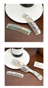 Close-up of marble pattern acetate wide-tooth hair combs on a wooden table with props