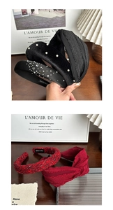 Detail showing pearl and rhinestone headbands with a handmade label on fabric