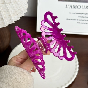 Elegant purple butterfly claw clip with marble texture and rhinestone accents