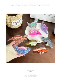 Detailansicht der bunten Dinosaurier-Haarklammern aus Acryl mit Glanzeffekt