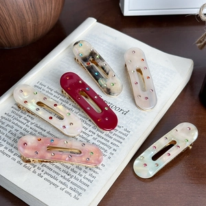 Set di 5 fermagli per capelli ovali in resina con strass colorati e motivi marmorei