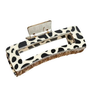 Classic black and white cow print rectangular hair claw clip for elegant styling