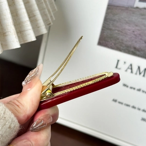 Glossy burgundy resin hair clip with gold metal spring for girls stylish side fringe hold