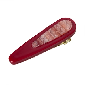 Red resin waterdrop hair clip with pink checkered pattern and gold metal base