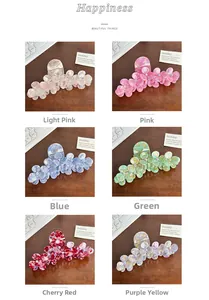 Detailed view of six floral acetate claw clips with rhinestones in marble colors
