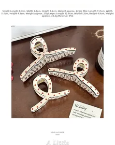 Detailed size comparison of PVC hair claws with red polka dots on ivory base