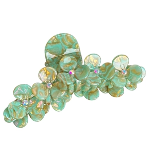 Green marble acetic acid hair claw with crystal-set flowers and a gold-tone finish