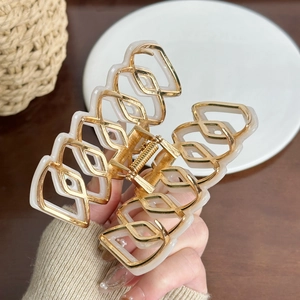 Elegant gold metal hair claw clip with cream white rhombic acetate pattern for women