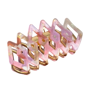 Elegant geometric hollow claw clip in pink purple marble resin and gold metal finish