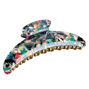 Large crescent hair claw clip in colorful marble acetate finish with gold metal teeth