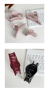 Detailed view of matte large hair claws in heart and geometric shapes for women