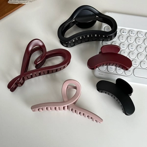 Minimalist large matte hair claw clip set for women in black, red, and pink colors