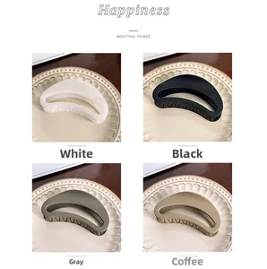 Detail of four matte 12cm shark hair claws in white, black, grey and coffee colors