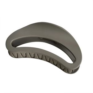 Large matte greyish-green crescent claw clip with hollow design for elegant hair styling