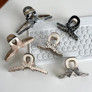 Five-pack polka dot and striped bow hair claws in minimalist cream and black tones
