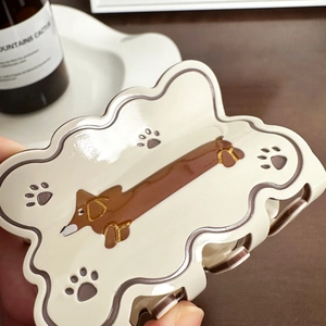 Dachshund pattern cream acetate hair claw clip for women in a stylish home setting