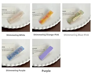Sélection de barrettes à vagues en acétate en cinq textures marbrées irisées et couleurs
