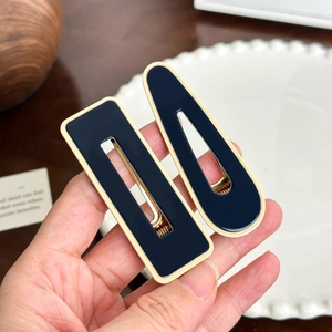 Minimalist navy blue acetate geometric hair clips set with cream frames and metal base