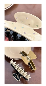 Detailed view of acetate shark hair clip featuring colorful crystals and vibrant dual-tone design