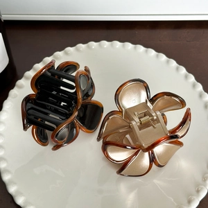 Elegant floral hair claw clips in black and champagne gold for stylish women hair accessories