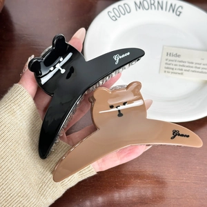 Cute bear-shaped hair claws in black and brown acrylic with Grace script detail