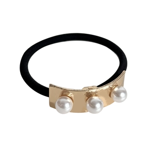 Elegant gold metal hair tie with three pearls on a high elastic black band for women