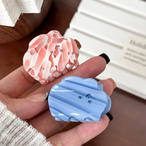 Cute cloud-shaped acetate hair clips with rhinestones in pink and blue marble finish