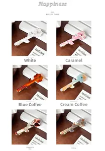 Detail view of acetate flower hair clips in six colors with rhinestone accents