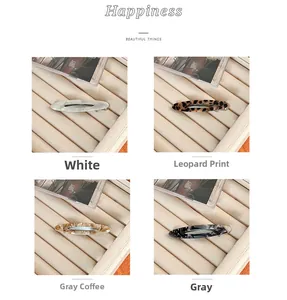 Détails de barrettes à cheveux en acétate blanc perle et motifs écaille de tortue