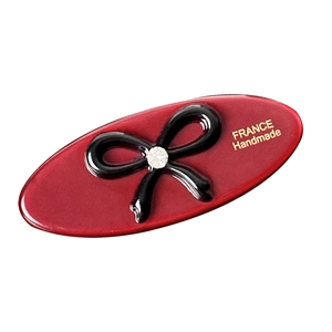Elegant oval red acetate hair clip with black bow and sparkling crystal diamond