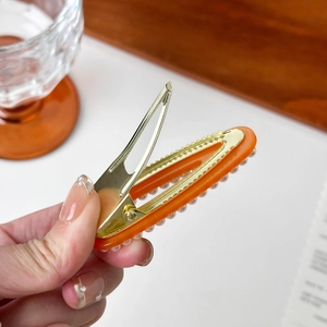 Elegant orange acrylic hair clip with pearls and gold metal duckbill clamp for women