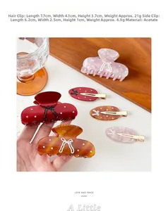 Detailed view of acetate hair claw and side clip with rhinestone bow decoration
