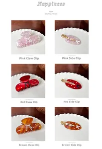 Close-up of acetate bow claw clips and side hairpins set with sparkly rhinestones