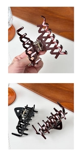 Detailed view of French vintage large tortoiseshell and black hair claws for long hair