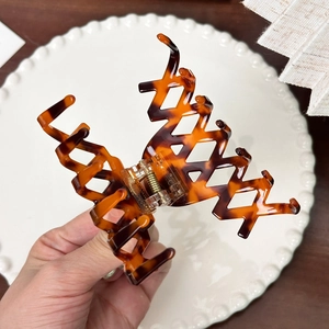 French vintage tortoise shell hair claw clip with cutout design and gold accent