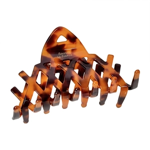 French vintage tortoiseshell hair claw clip with cutout design and gold lettering