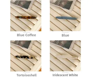 Detail view of four elegant acetate hair clips in leopard, blue, beige, and pearl patterns