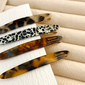 Set of four minimalist acetate hair clips with leopard and tortoiseshell patterns
