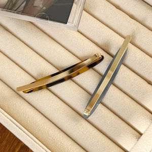 Minimalist acetate hair clip set with tortoise pattern and gold metal strip details
