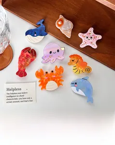 Macro detail of eight acetate ocean animal hair clips including starfish and seahorse