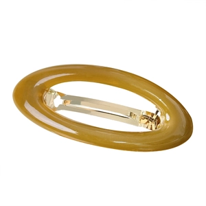 Minimalistische ovale Haarklammer aus bernsteinfarbenem Harz mit goldener Metallfeder