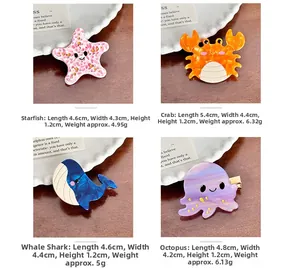 Detailed view of ocean-themed acetate hair clips in starfish, crab, shark and octopus shapes