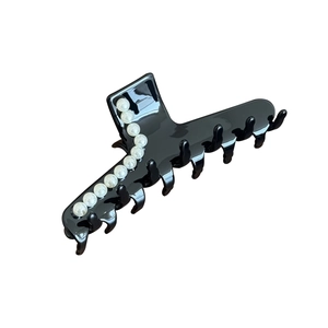 Large black acetate hair claw clip with elegant pearl embellishments for hair styling