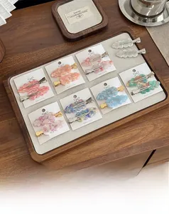 Macro shot of colorful acetate hair clips with marble texture on a white display card
